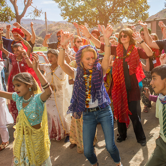  Volunteers take part in a welcoming 